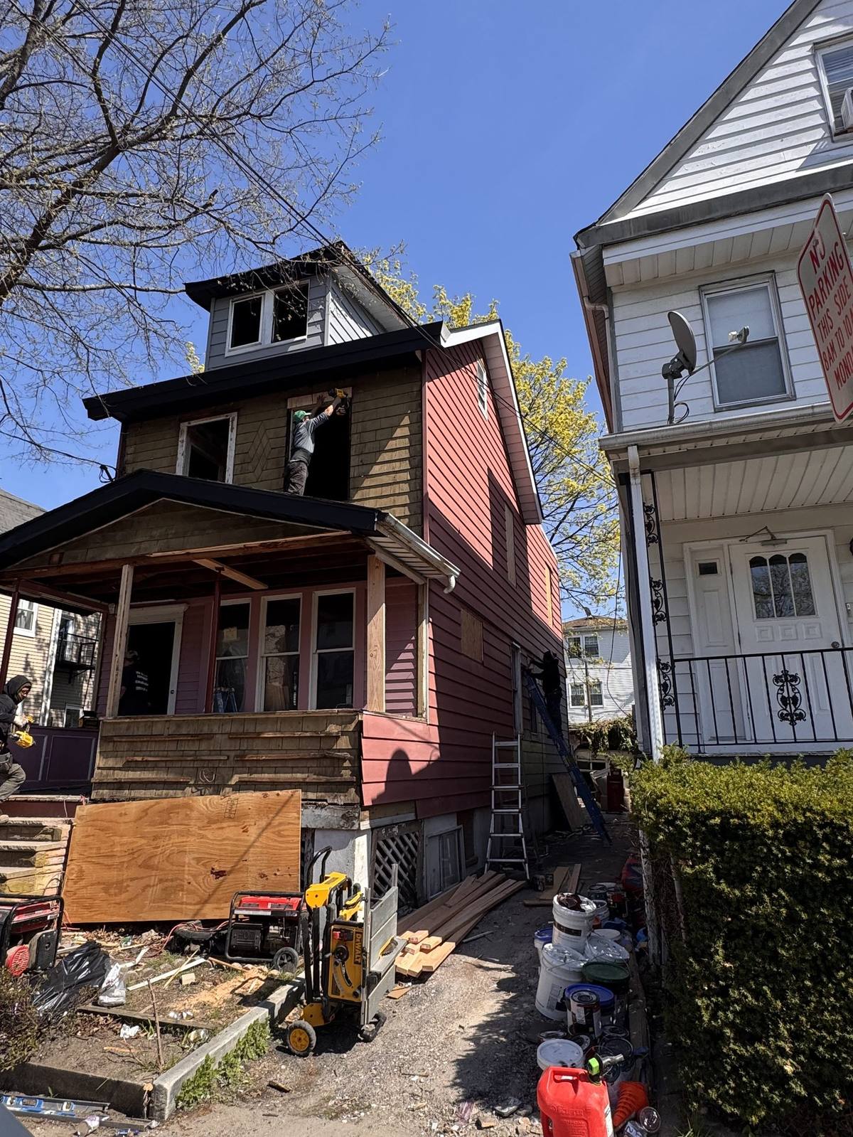 Before renovation: original aged siding and structure